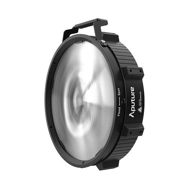 Front view of a round black fresnel lens attachment with a ribbed metal body and top handle, showing the glossy glass lens face.