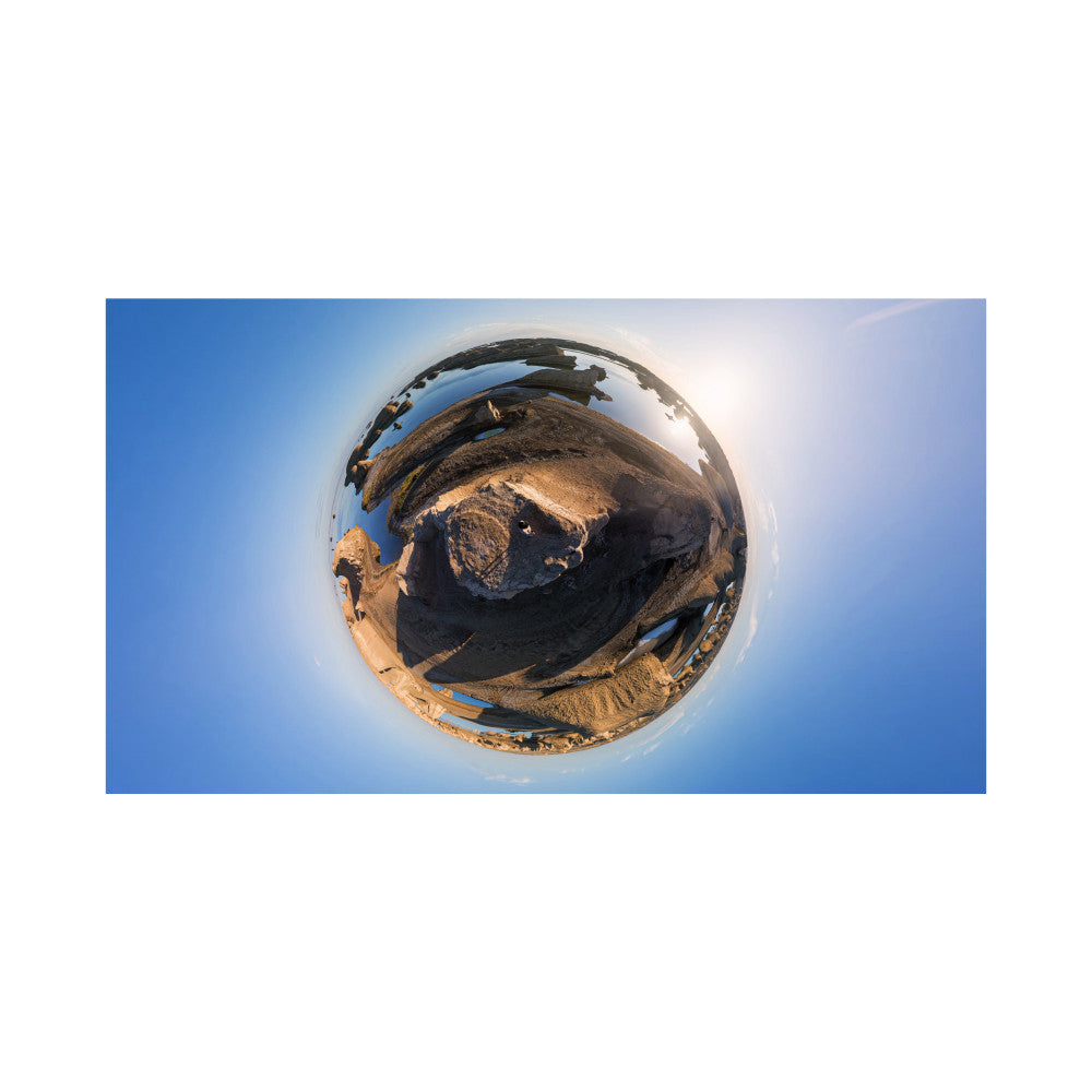 360-degree spherical view of desert landscape with rocky terrain and blue sky, demonstrating immersive panoramic photography capability.