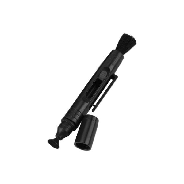 Black lens cleaning pen displayed at an angle, showing the brush tip at top and retractable cleaning tip at bottom with protective cap.