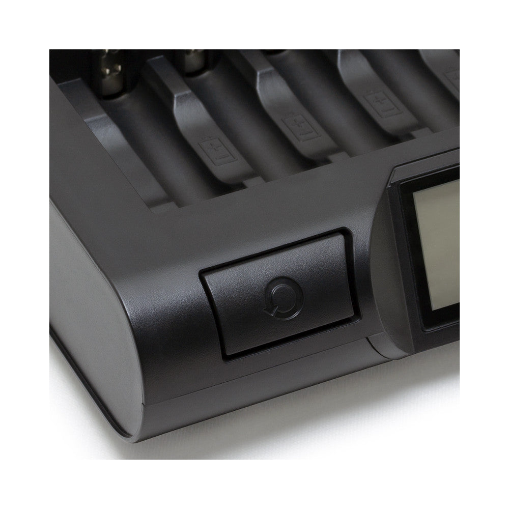 Close-up angled view of black battery charger showing eight charging slots at top and power button on front panel.