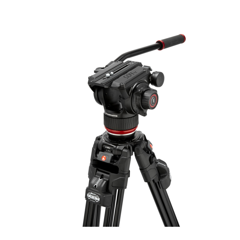 Professional video tripod system with fluid head and telescoping legs shown at three-quarter angle against white background.
