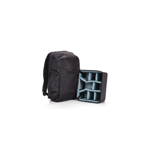 Black camera backpack shown closed and open, displaying interior compartments with dividers on white background.