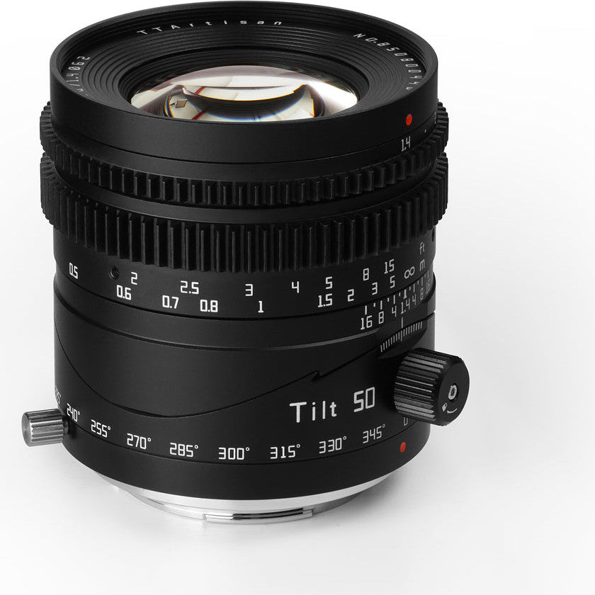 Black manual focus 50mm lens with tilt mechanism shown at three-quarter angle against white background, displaying focus ring and tilt degree markings.