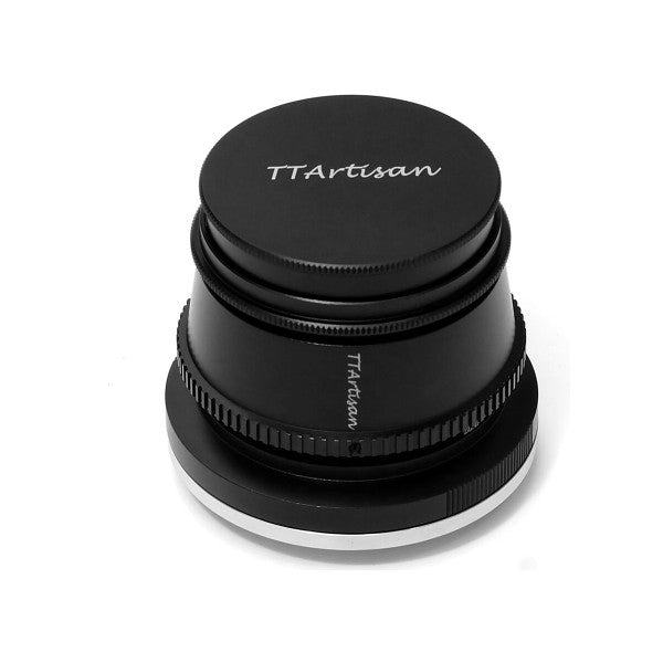 Black TTArtisan 35mm f/1.4 lens shown from above at an angle, displaying the threaded mount, focus ring, and aperture ring with the lens cap on top.