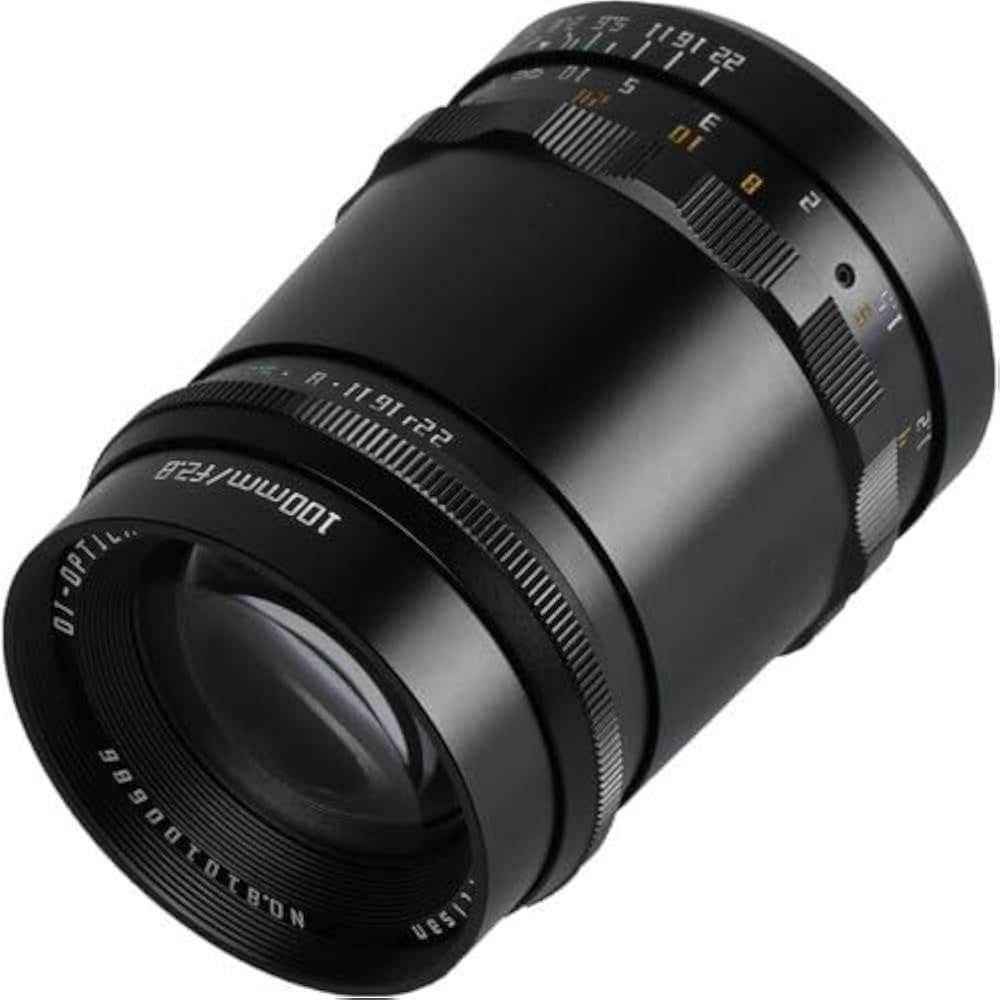 Black TTArtisan 100mm f/2.8 lens shown at angled side view, displaying front glass element, focus ring, and aperture markings against white background.