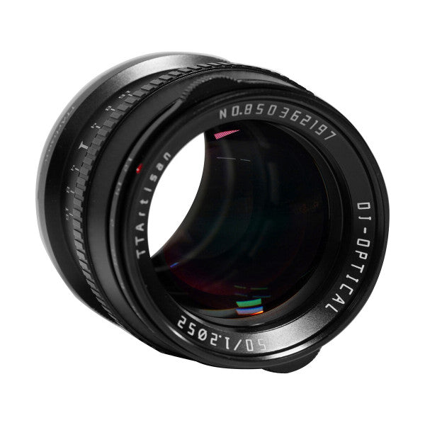 Close-up side view of a black TTArtisan 50mm f/1.2 lens showing the barrel, aperture ring, and front glass element against a white background.