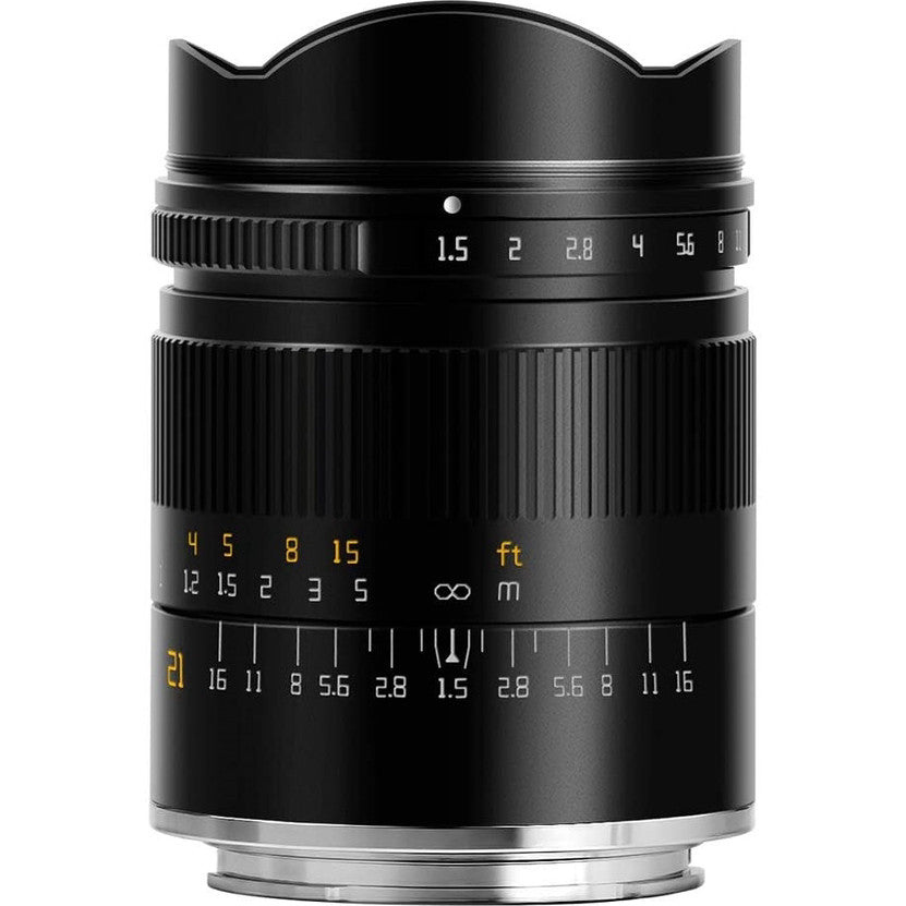 Black manual focus lens shown from front angle, displaying aperture ring, focus ring with distance markings, and wide-angle hood.