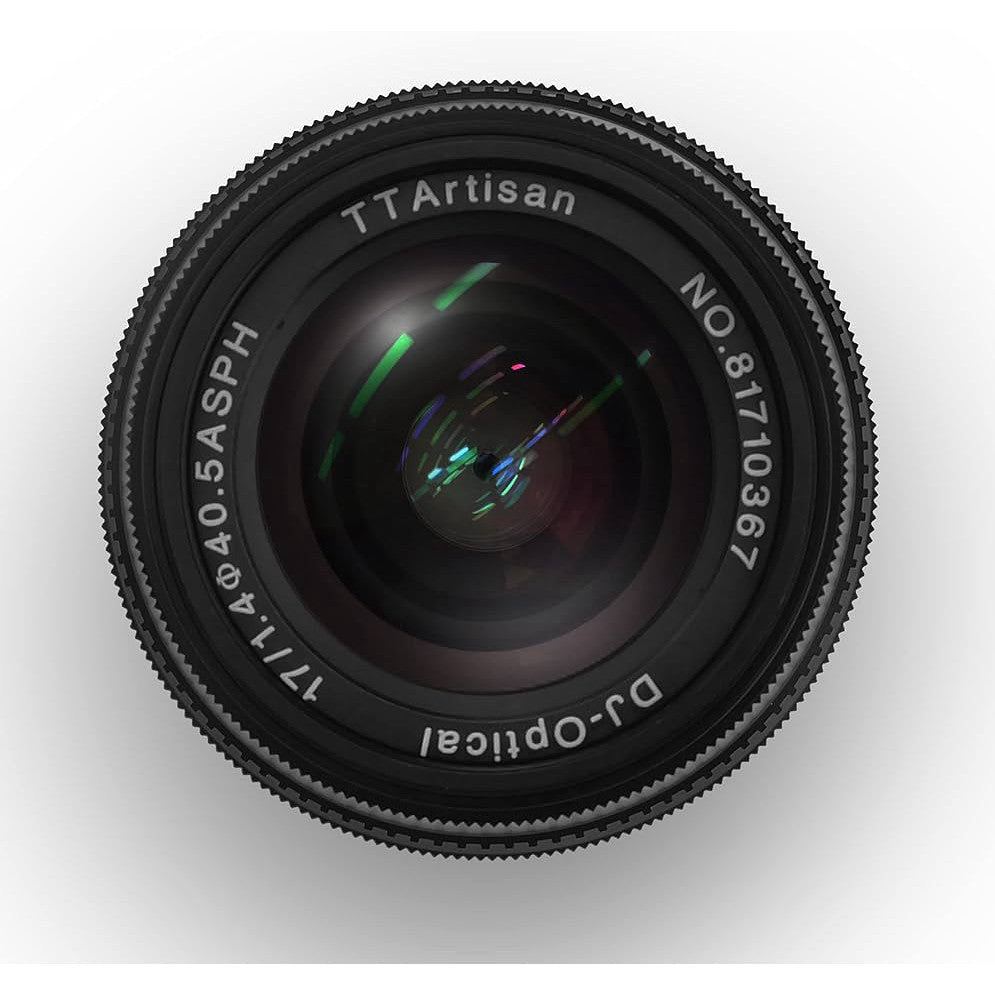 Front view of a black TTArtisan 17mm f/1.4 lens showing the glass elements and focusing ring against a white background.
