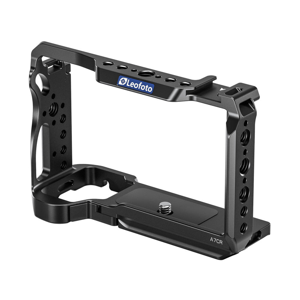 Black aluminum camera cage with top handle and mounting plate, shown from front-right angle against white background.