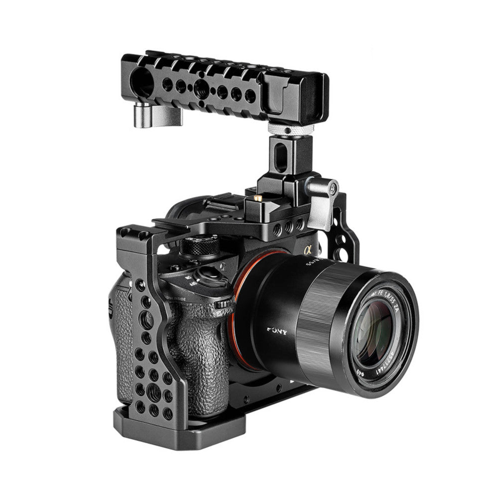 Black camera cage with top handle mounted on Sony Alpha mirrorless camera with lens, angled three-quarter front view.