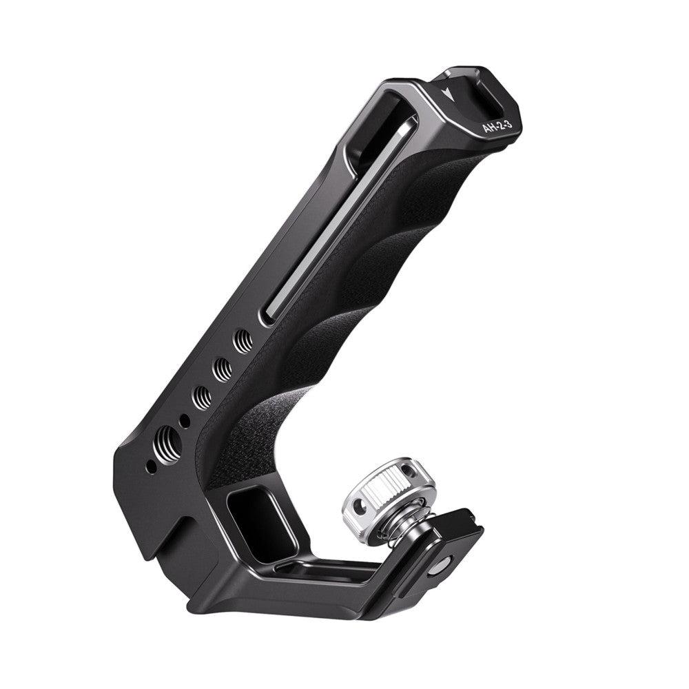 Black camera top handle with ergonomic grip and cold shoe adapter attachment, shown at an angle against white background.