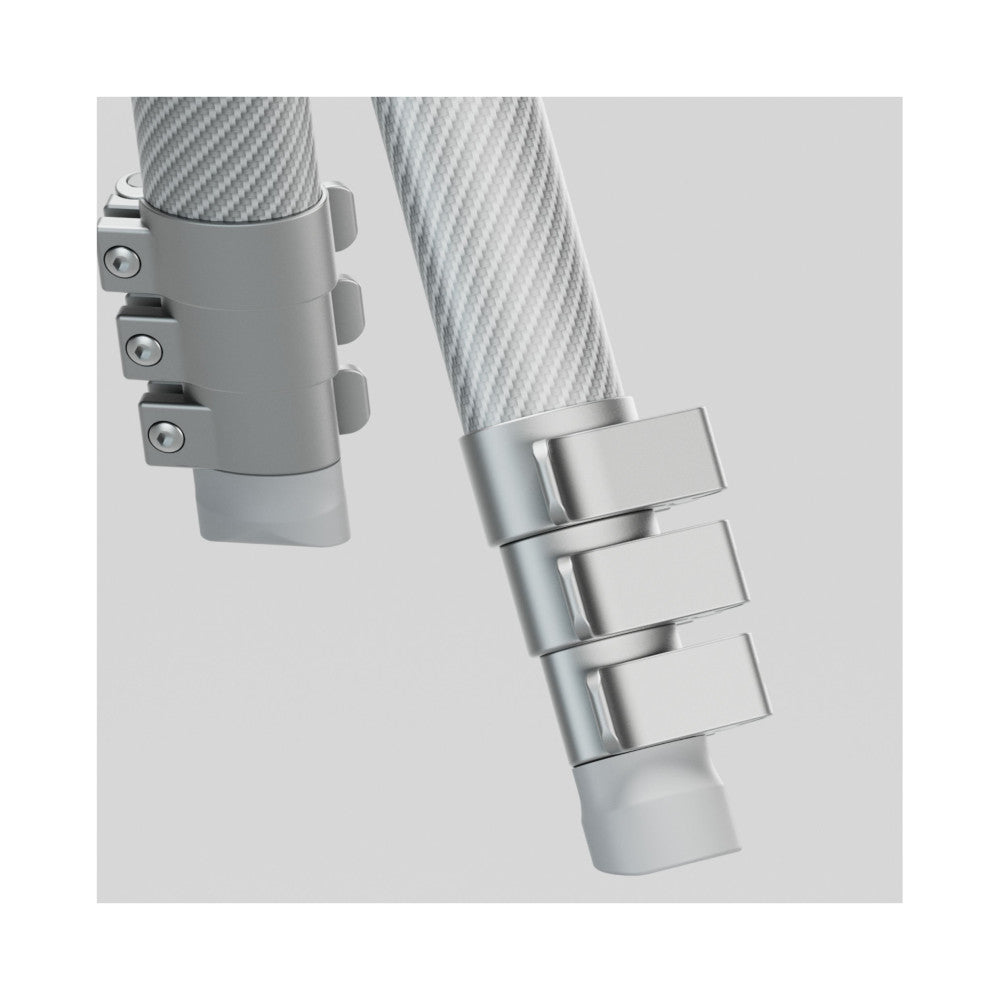Close-up detail of carbon fiber tripod leg sections with metal locking collar bands and adjustment mechanisms against a neutral background.
