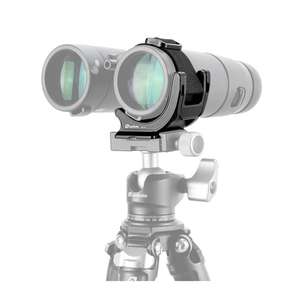 Leofoto binocular clamp mounted on tripod head, showing side view with binoculars secured in the clamp and adjustment knob visible below.