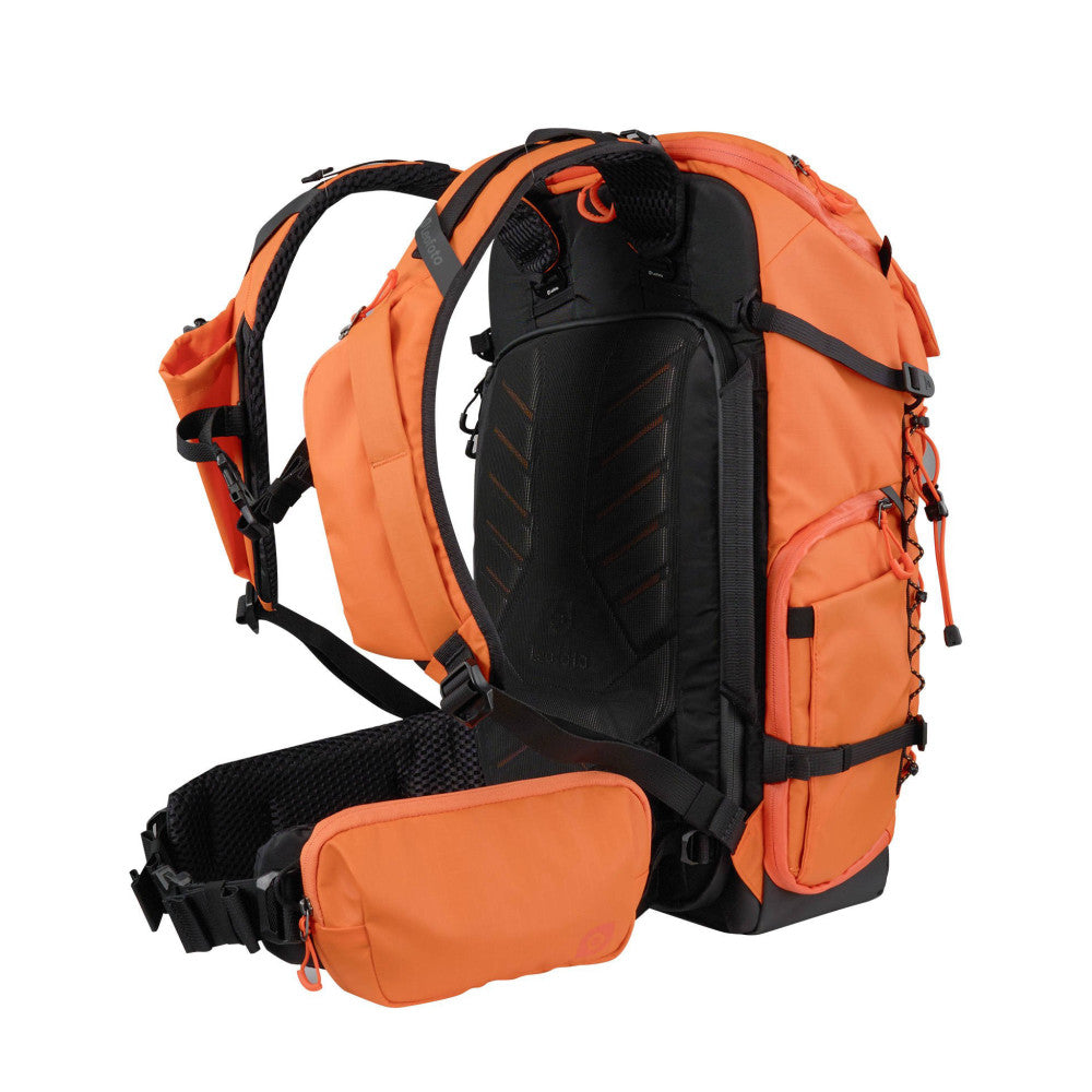 Orange and black 35L camera backpack shown from rear three-quarter view, displaying padded straps, mesh ventilation panel, side pockets, and detachable waist bag.