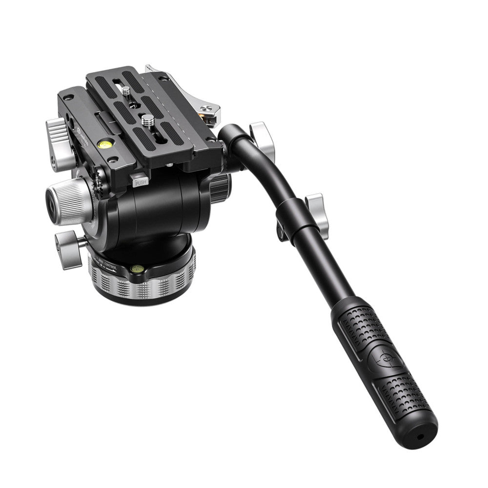 Professional video fluid head with pan handle shown at an angle, displaying the tripod plate, friction adjustment knobs, and leveling bubble.