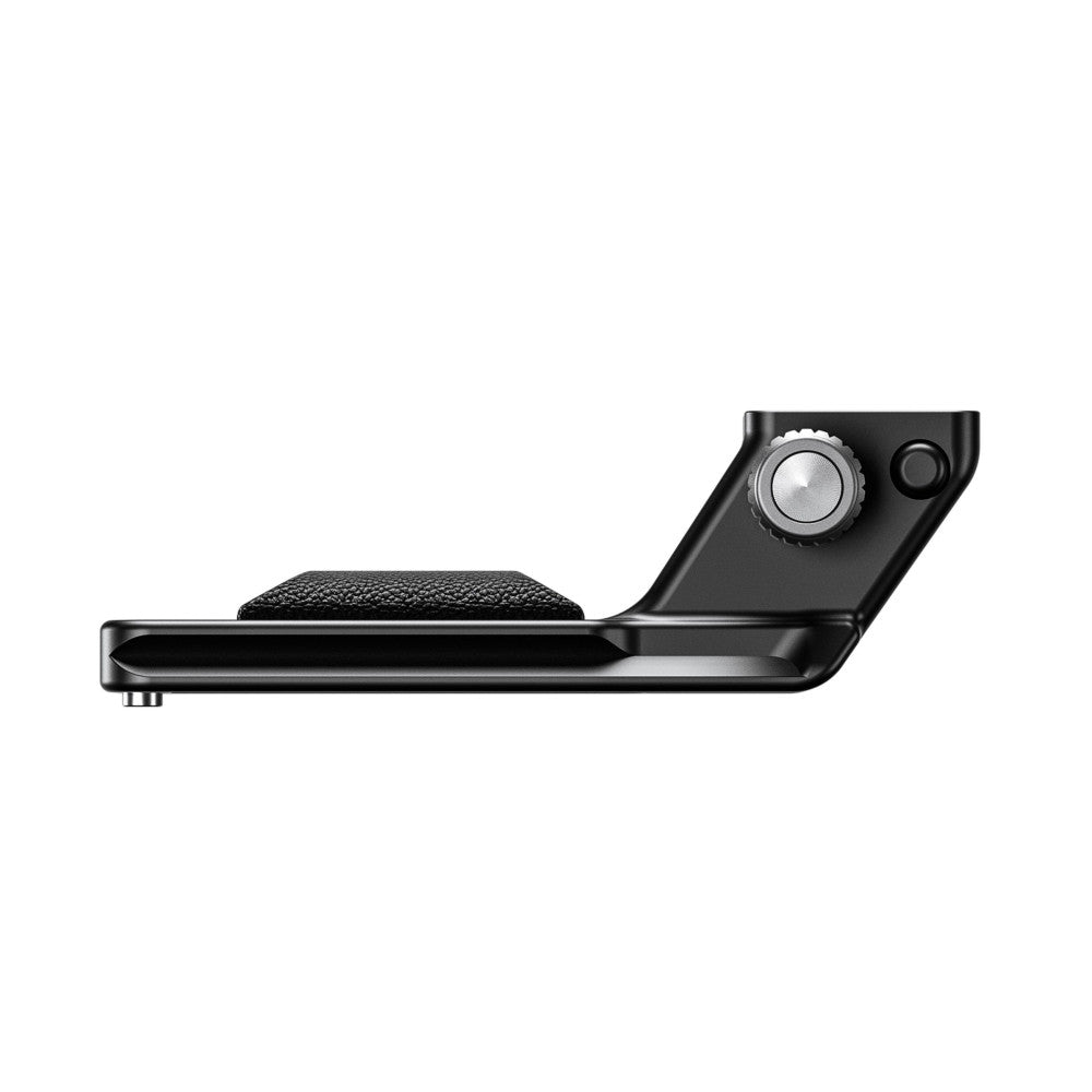Black lens foot with textured grip pad and adjustment knob, side view showing Arca-Swiss interface plate and control dial.