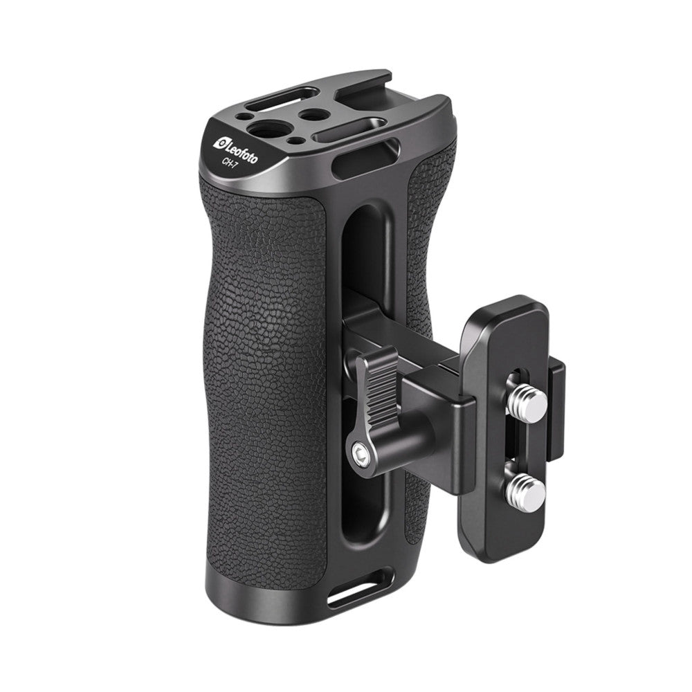 Black camera side handle with textured grip and attached rail mount bracket, shown at three-quarter angle against white background.