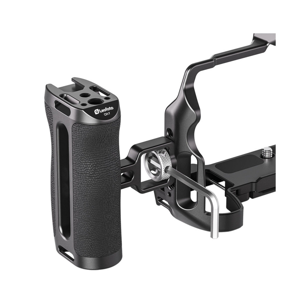 Black side handle with textured grip mounted to articulating arm bracket, shown from angled three-quarter view against white background.