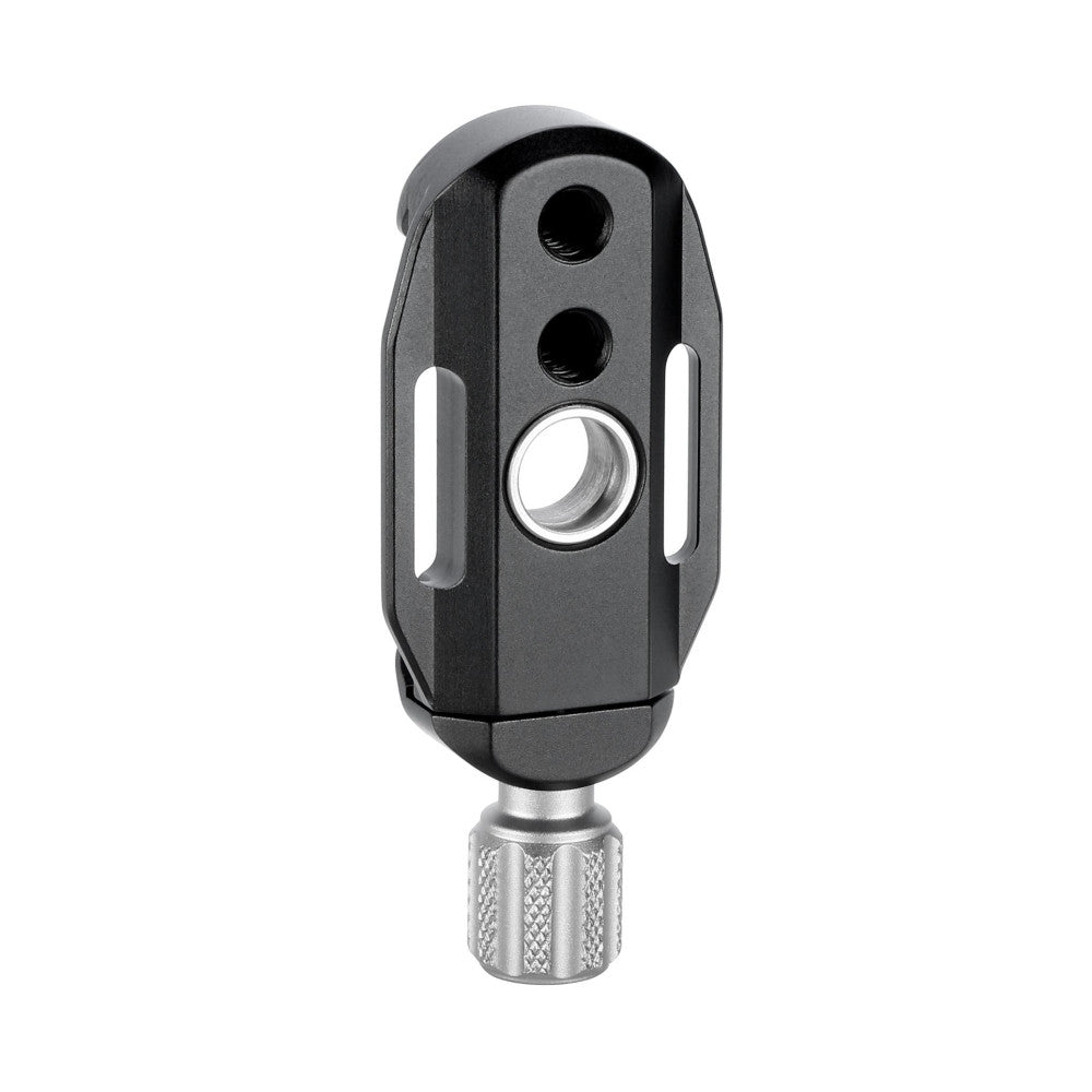 Black Arca Swiss quick-release clamp with dual mounting holes and central lens, attached to textured metal base, shown from front angle against white background.