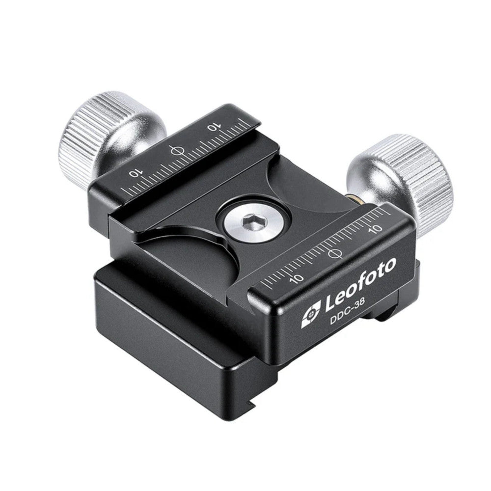 Black camera clamp with dual metal knobs and measurement markings, shown from angled overhead view against white background.