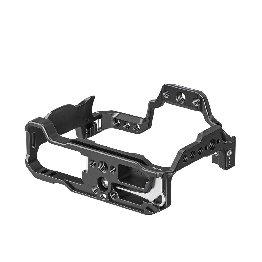 Black aluminum camera cage with multiple threaded mounting points, shown in three-quarter view against white background.