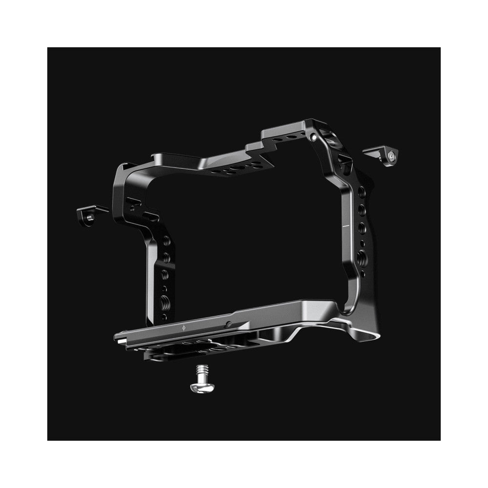 Black metal camera cage with aluminum accents shown from isometric angle against dark background, featuring mounting points and adjustment knobs.