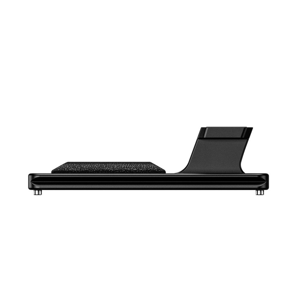 Side view of a black lens foot showing textured pad surface on left and curved mounting bracket on right.