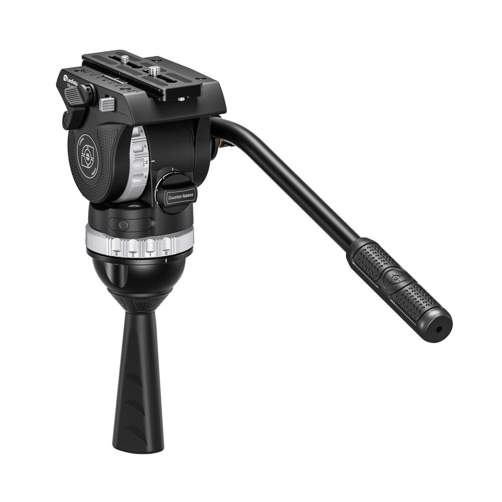 Professional video fluid head shown from the side angle, featuring black construction with pan/tilt controls, counterbalance dial, and extended pan handle.