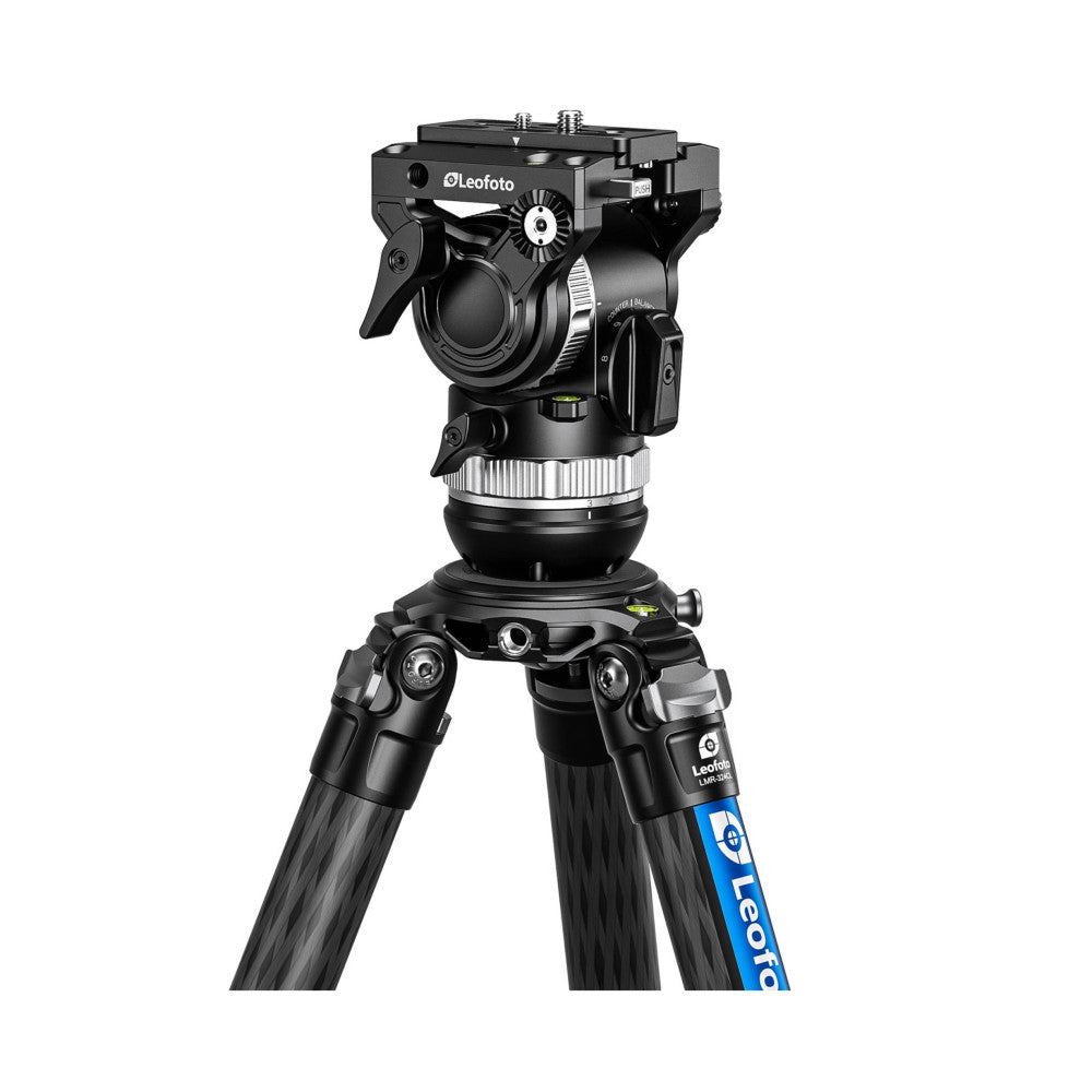 Leofoto FH-5L video fluid head mounted on tripod legs, shown from front-angled view displaying pan-tilt mechanism and control handles.