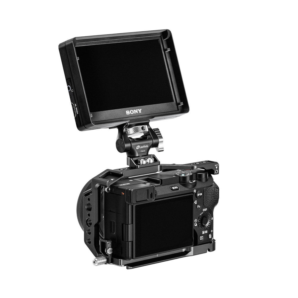 Black monitor mount with dual screw attachment holding Sony monitor above professional camera body, shown in product setup view.