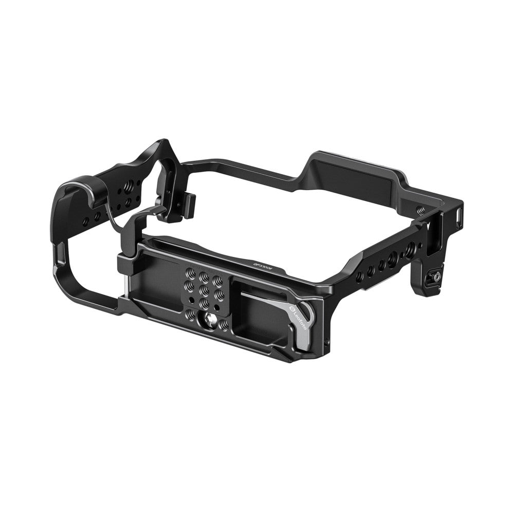 Black aluminum camera cage with adjustable straps and mounting points, shown at a three-quarter angle against white background.