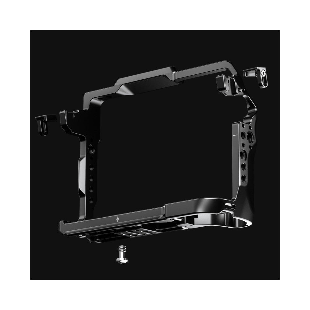 Black aluminum camera cage with articulating arms and mounting points, shown in three-quarter view against dark background.