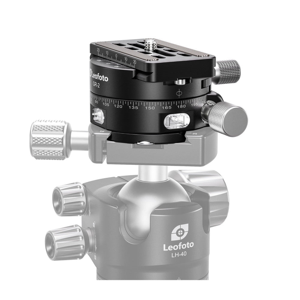 Black geared panning clamp with panoramic scale mounted on silver ball head, shown from front three-quarter view against white background.