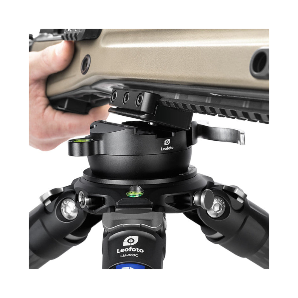 Leofoto GS-1 adapter mounted on tripod head, showing NATO rail attachment and picatinny dovetail interface with rifle mounted above.