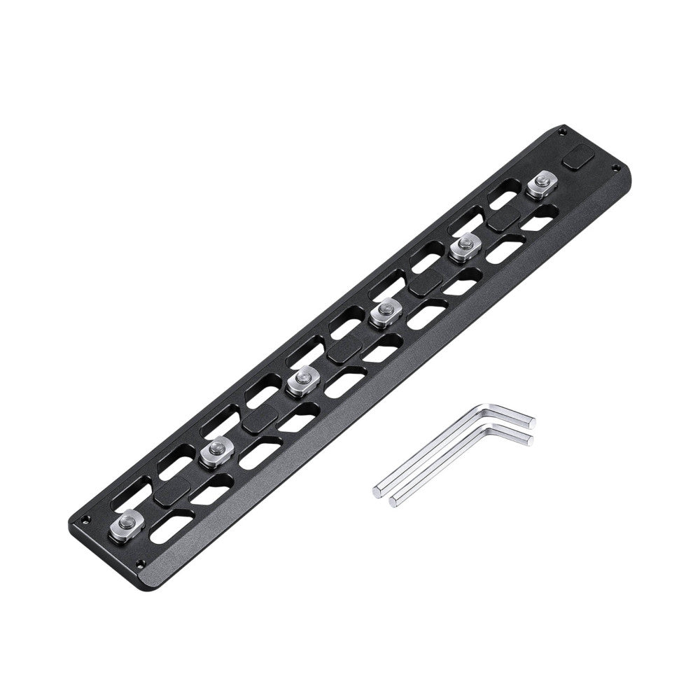 Black M-LOK quick release plate with six metal mounting knobs displayed at an angle with two included hex wrenches.