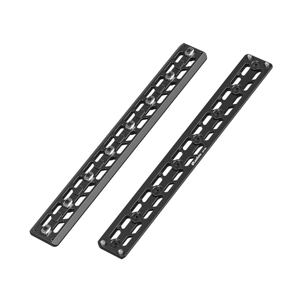 Two black M-LOK quick release plates shown at an angle, displaying their slotted design and mounting hardware from above.