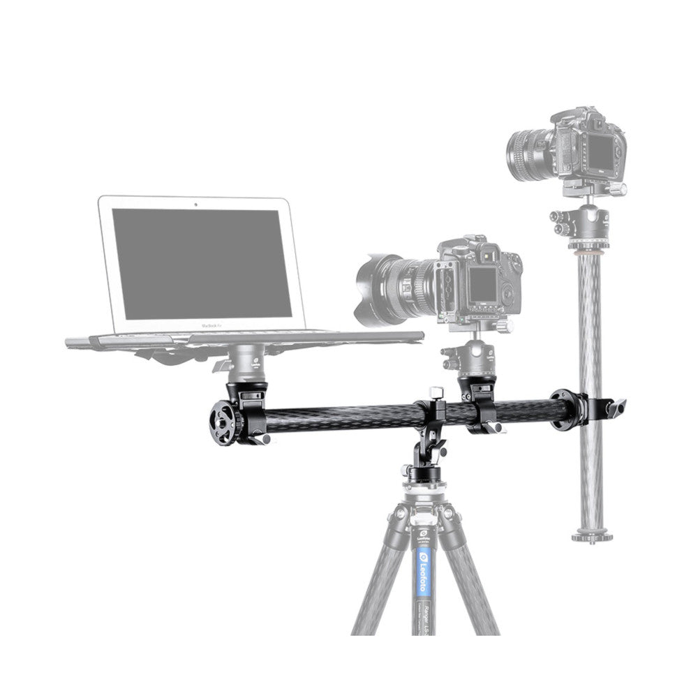 Professional camera rig setup showing horizontal carbon fiber column with mounted cameras, laptop monitor, and vertical extension arm on tripod base.