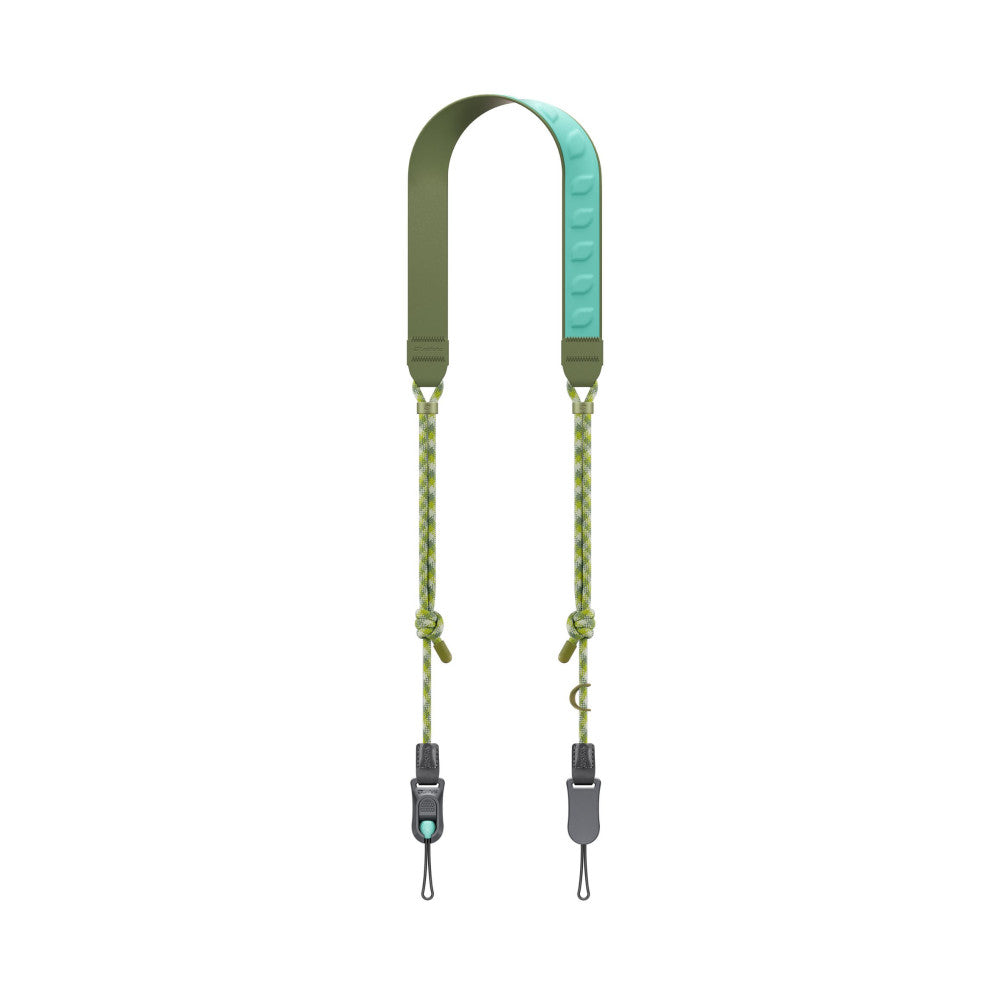 Flat lay view of a two-point camera strap with olive green neoprene shoulder pads, yellow-green webbing, and dark gray plastic connectors with carabiners.