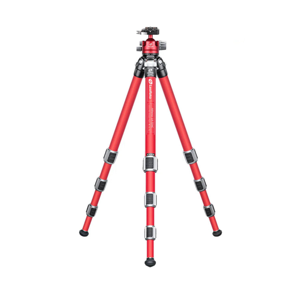Red carbon fiber tripod with ball head mounted on top, shown in fully extended position against white background.