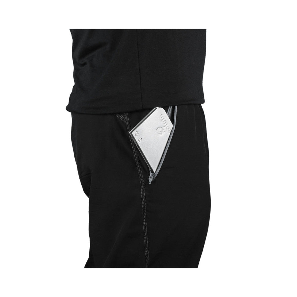 White folding tray with 1/4 thread displayed in pants pocket, showing practical storage and portability.