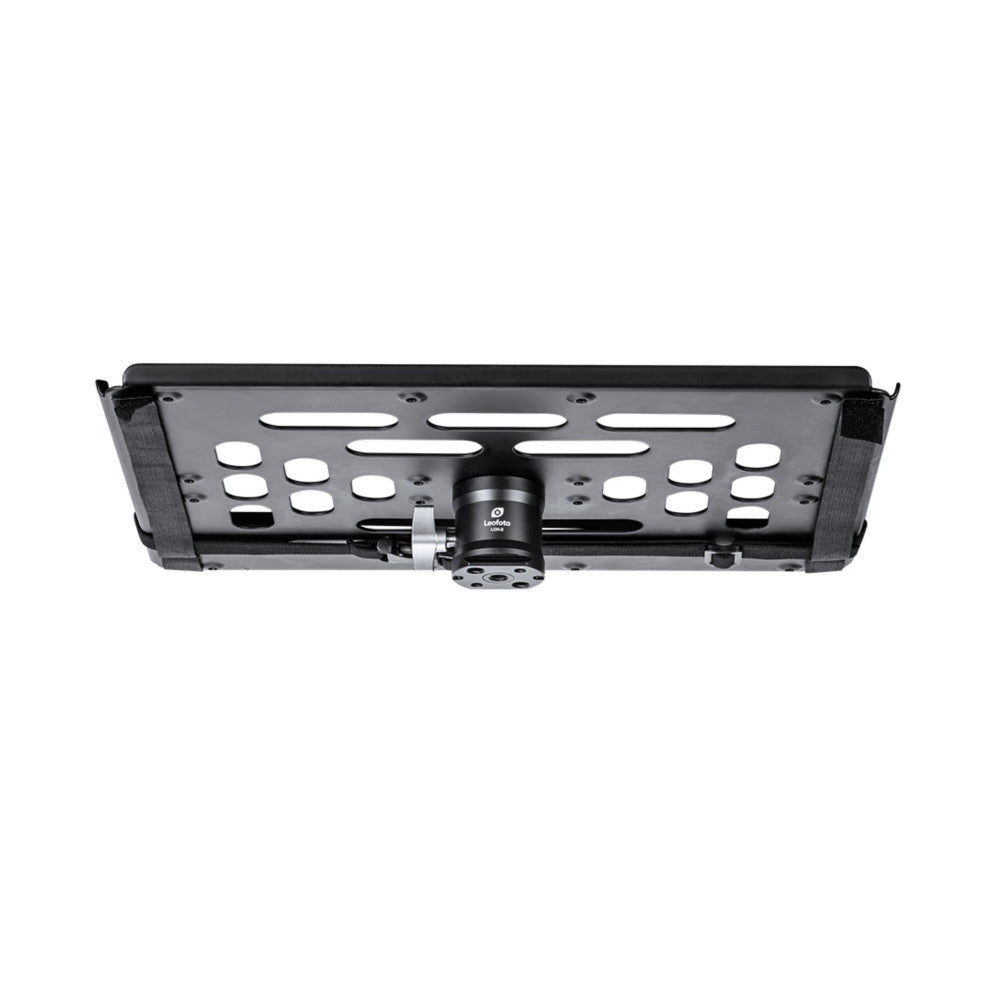 Overhead view of a black Leofoto laptop tray showing perforated metal surface with mounting hardware and central spigot connector.
