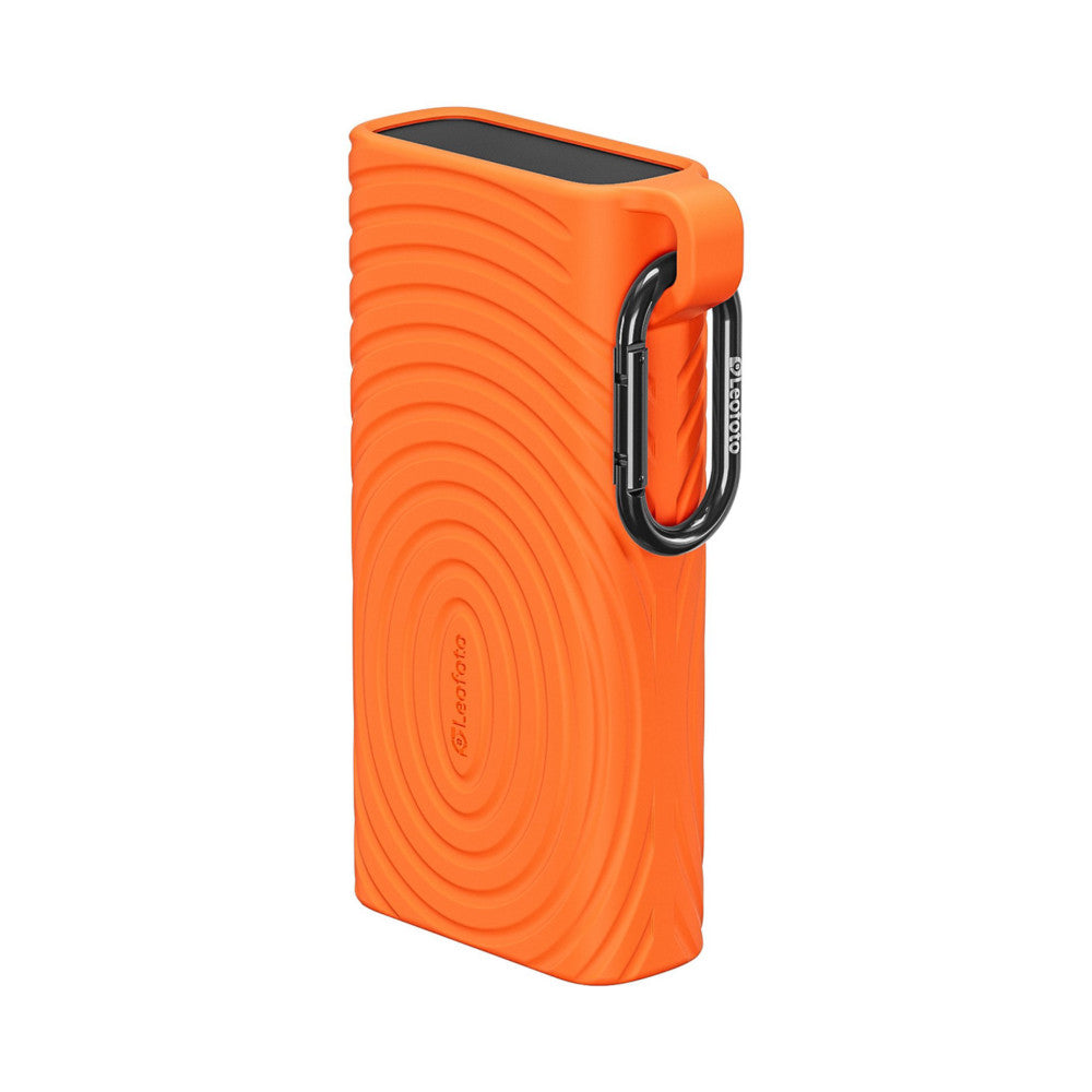Orange rectangular memory card reader case with rippled texture, carabiner clip, and black top panel, shown at three-quarter angle against white background.