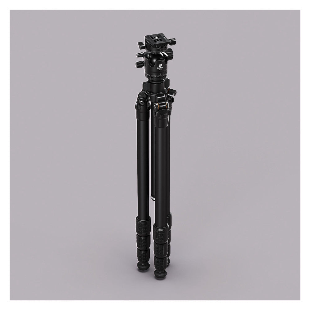 Black carbon fiber tripod with ball head mounted on top, shown fully extended against neutral gray background, front three-quarter view.