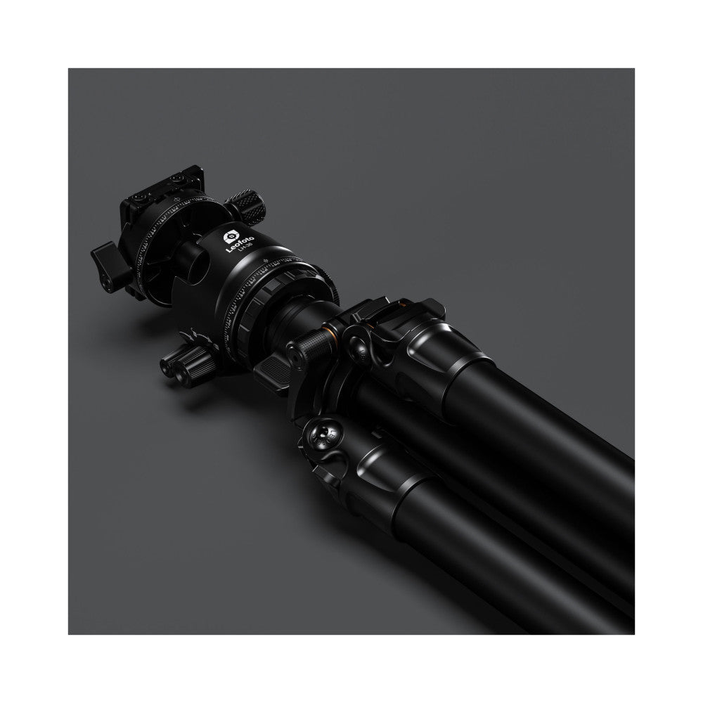 Black carbon fiber tripod with ball head mounted on top, shown at an angled side view against gray background.