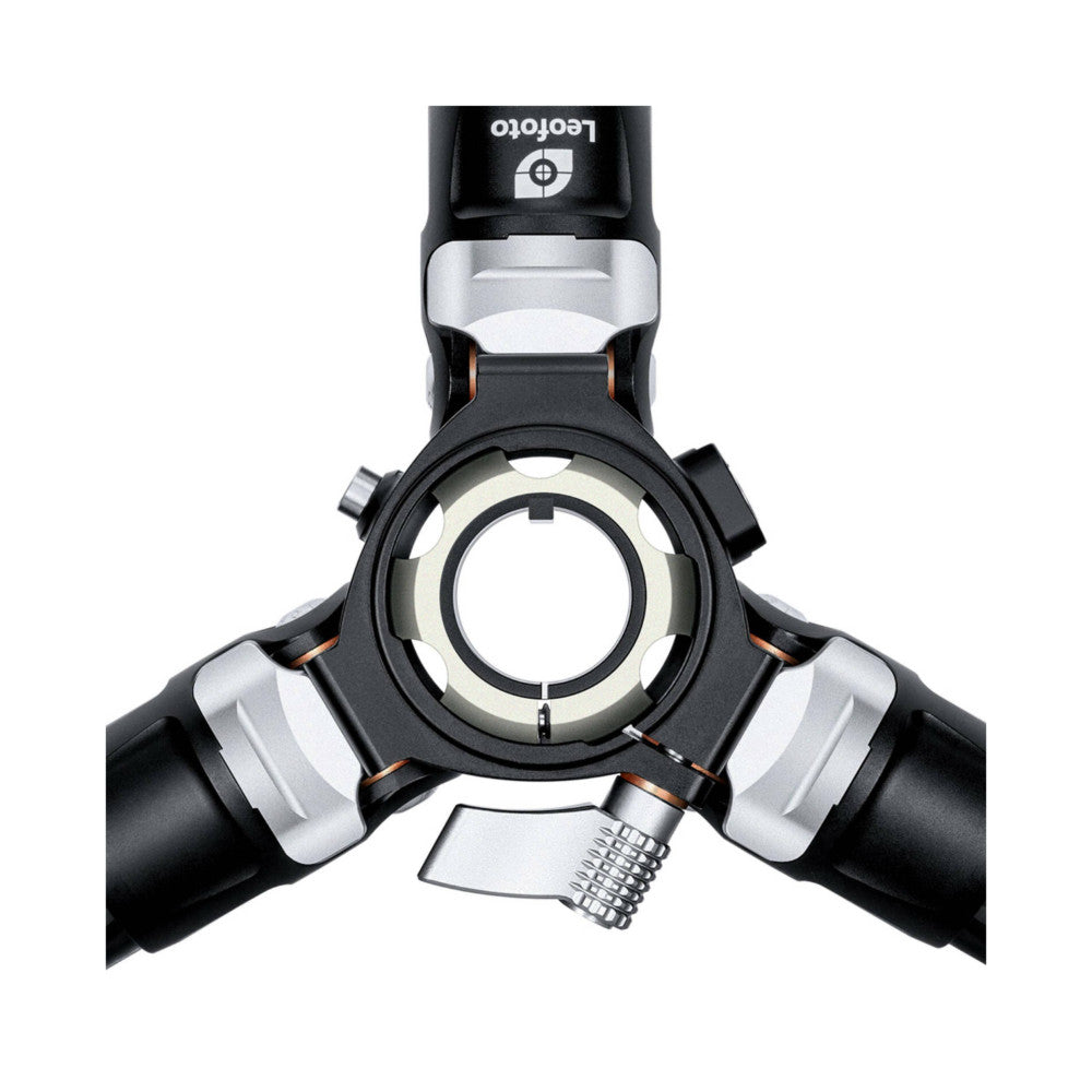 Top-down view of Leofoto tripod head showing three black legs with silver accents and central leveling column against white background.