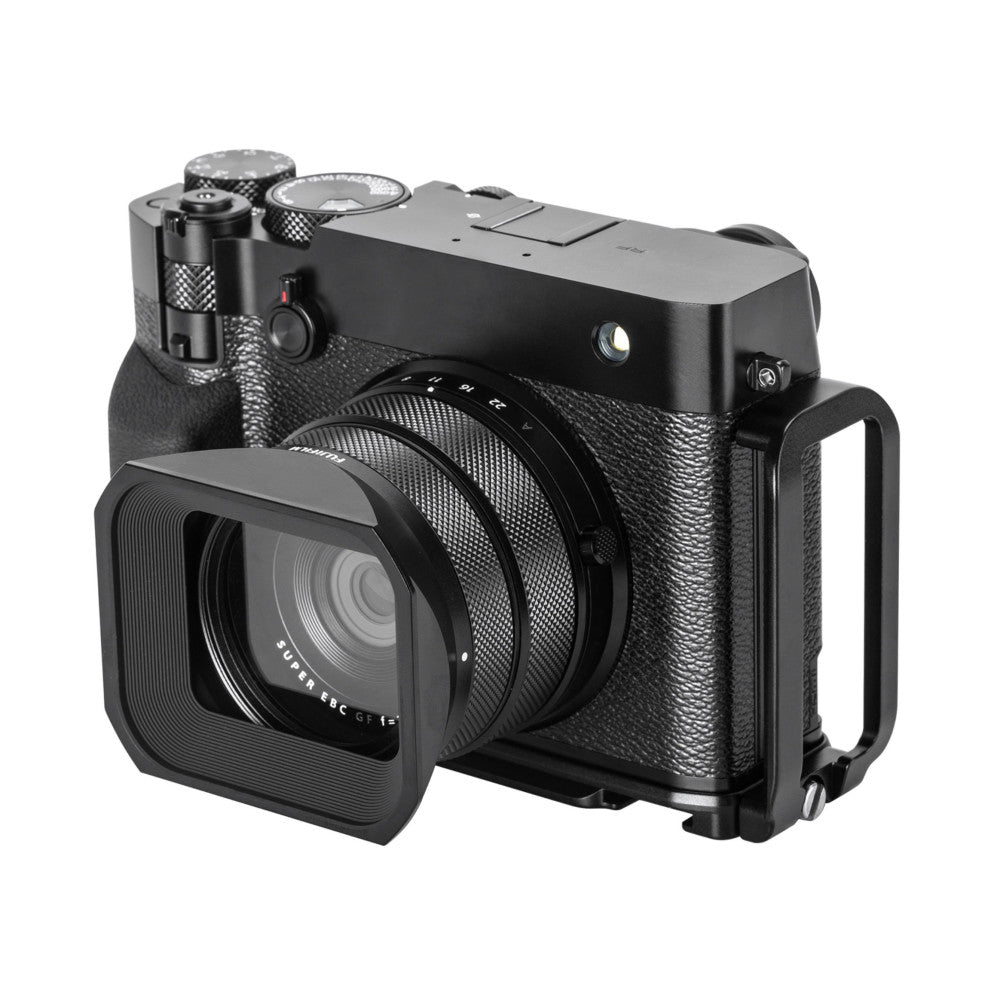Black L-bracket mounted on Fujifilm GFX100RF camera shown from three-quarter front view with lens hood attached.
