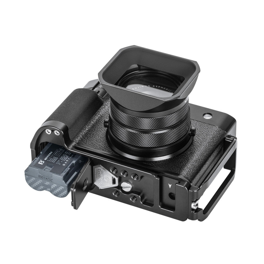 Black L-bracket mounted on Fujifilm GFX100RF camera body, shown from three-quarter angle with lens attached and hood extended.