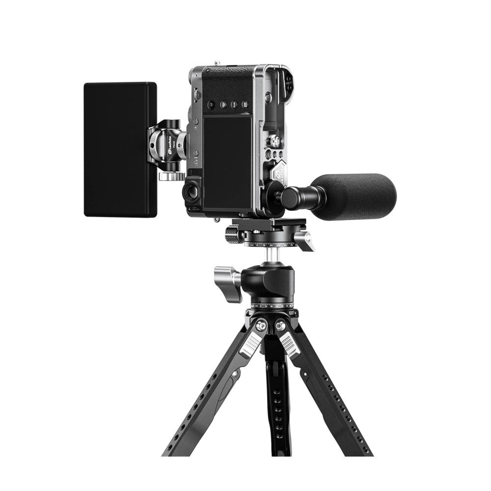 Compact camera mounted on tripod with L-bracket, microphone, and monitor accessories shown in product display setup.