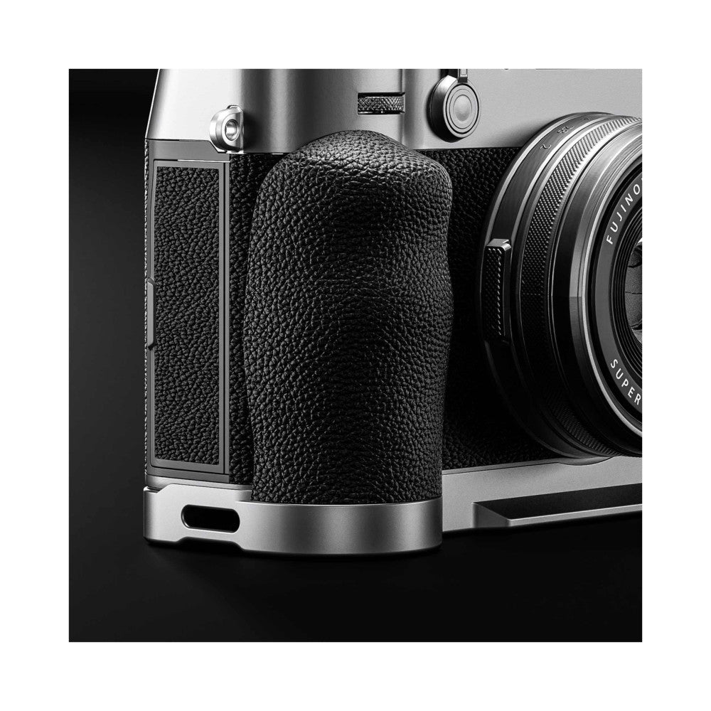 Silver L-bracket mounted on Fujifilm X100VI camera, showing textured grip and metal accents from front-left angle.