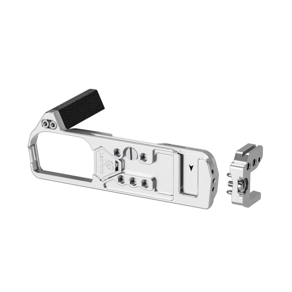 Silver L-bracket with black foam pad and detachable mounting plate shown disassembled against white background.